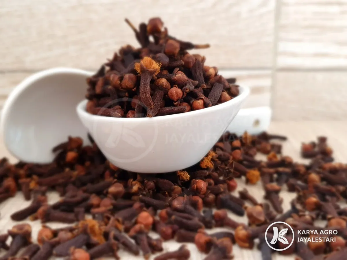 Whole cloves in a white bowl